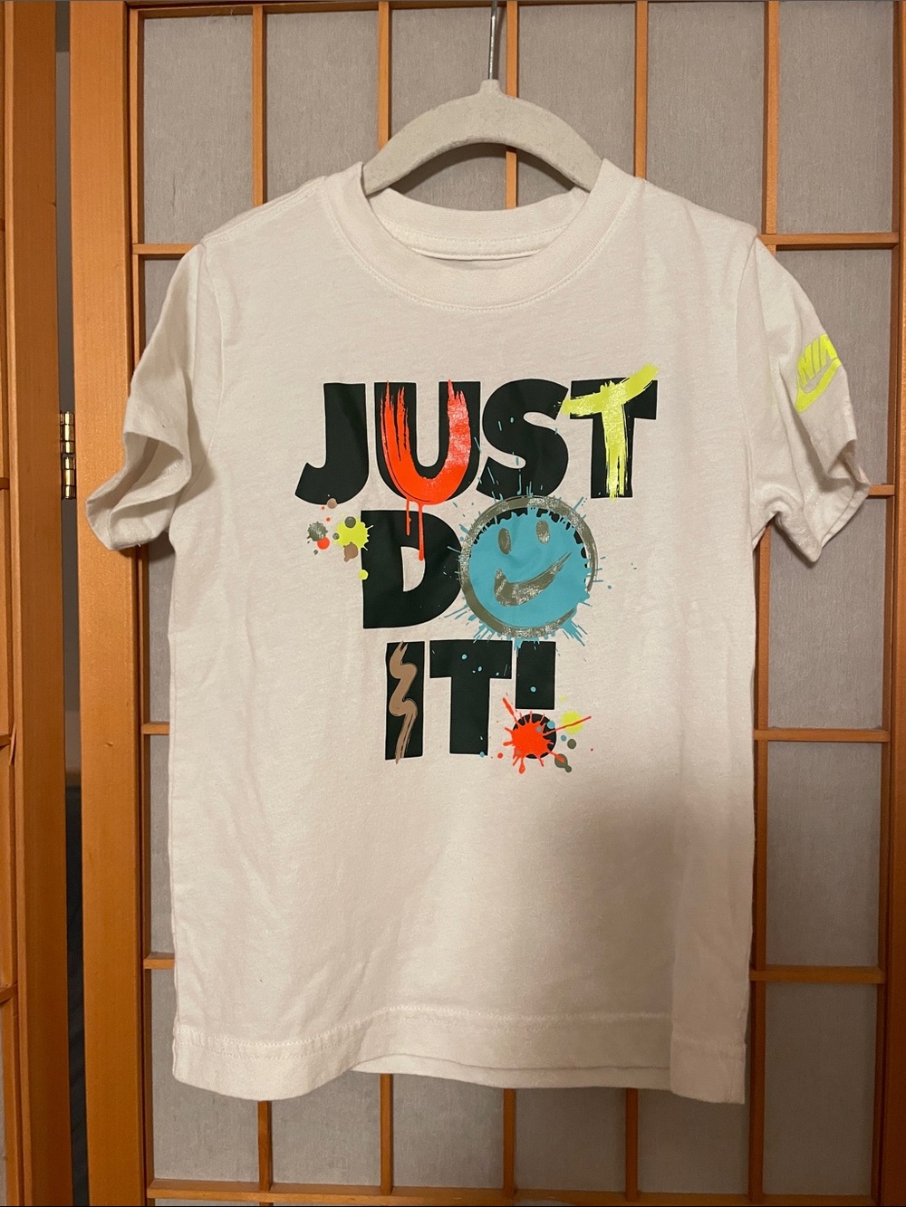 Nike Boys Size 4 XS White Short-Sleeve Tee with Colorful 'Just Do It' Graphic